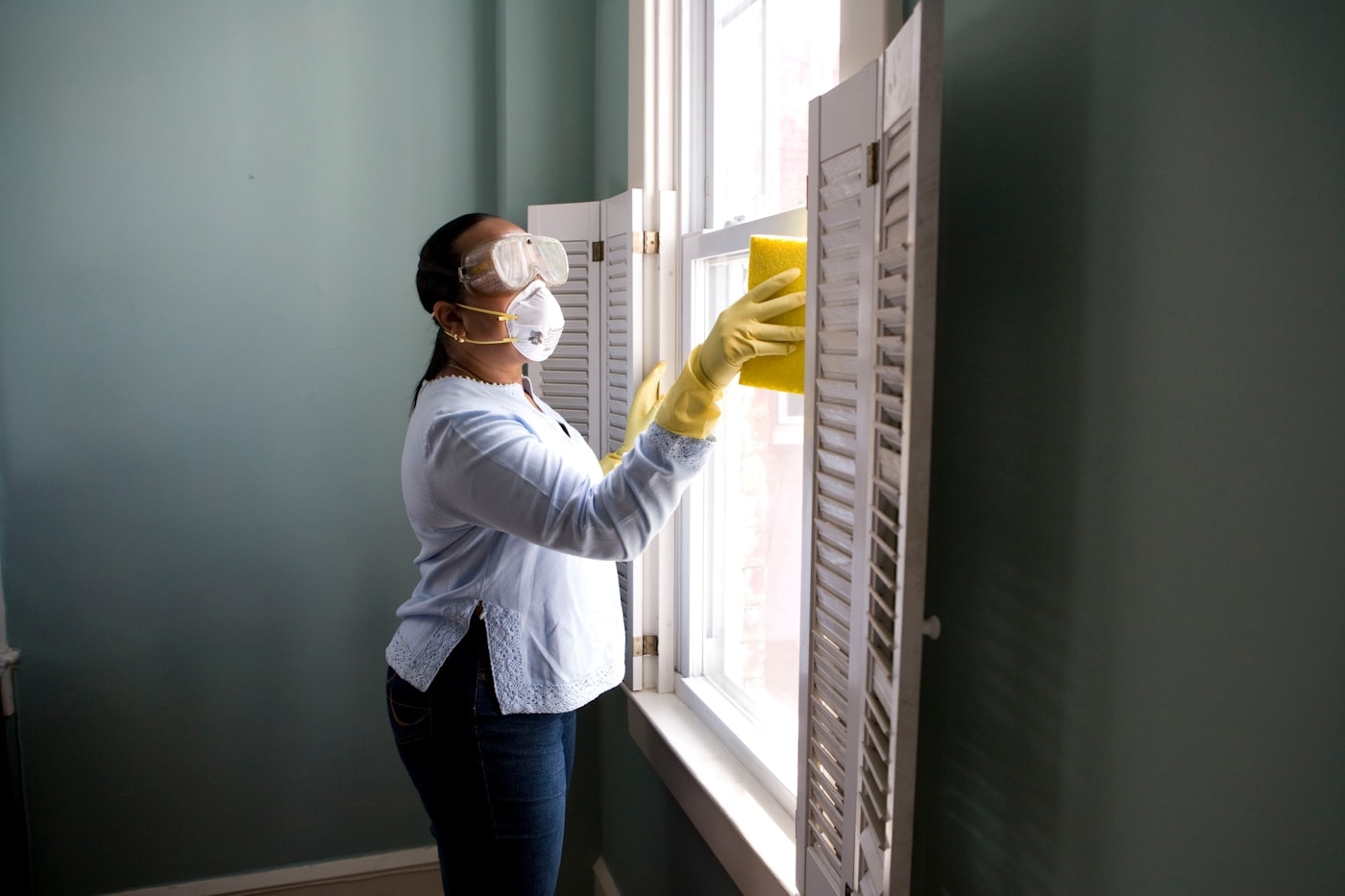 Professional home cleaner providing residential cleaning service