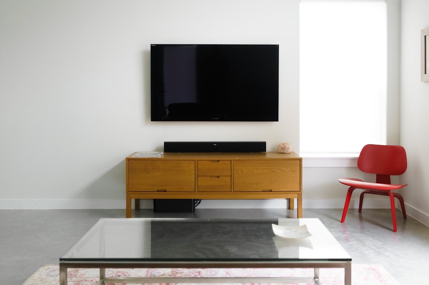 Wall-mounted flat screen TV in a modern living room